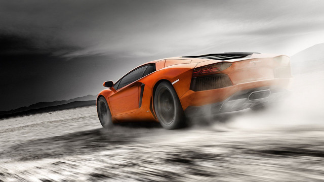 Orange car dusty tires motion free wallpaper for desktop - medium preview image