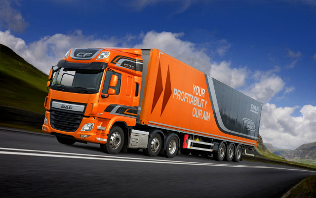 Orange truck mountain road clouds free wallpaper for desktop - medium preview image