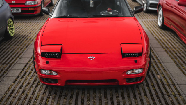 Red car parking lot truck free wallpaper for desktop - medium preview image