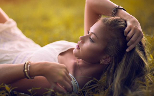 Woman lying grass ponytail jewelry free wallpaper for desktop - medium preview image