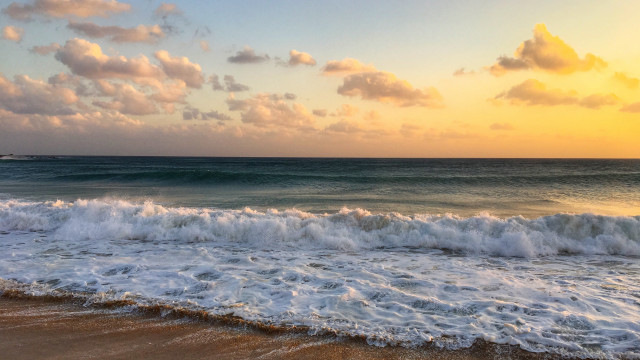Beach waves sunset boat cityscape free wallpaper for desktop - medium preview image
