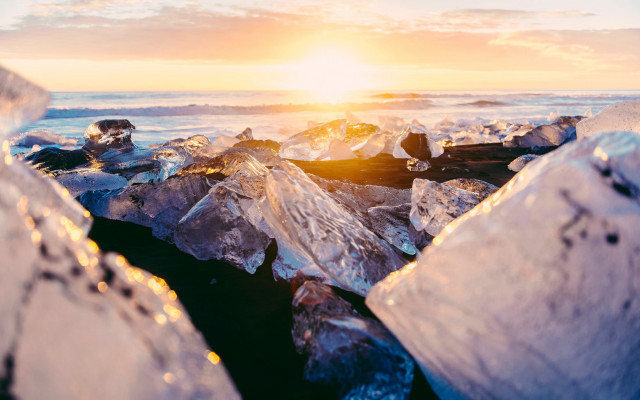 Ice chunks beach sunset ocean free wallpaper for desktop - medium preview image