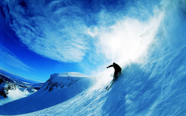 Skiing snowy mountain blue sky free wallpaper for desktop - medium preview image