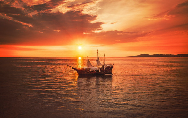 Boat sunset clouds city mountains free wallpaper for desktop - medium preview image