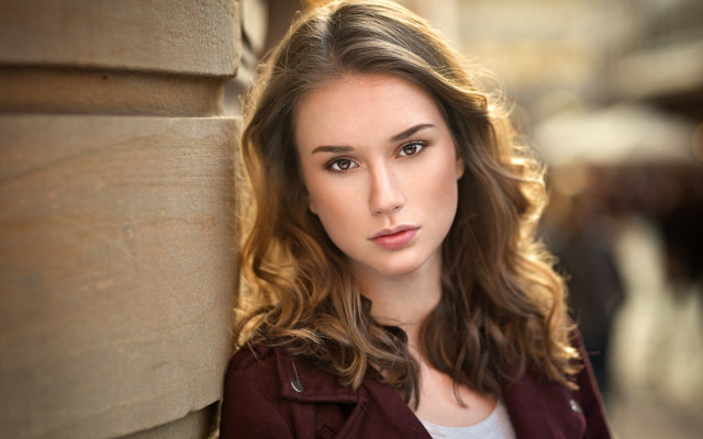 Woman portrait serious browneyes redjacket free wallpaper for desktop - medium preview image