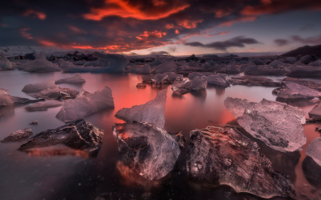 Sunset water rocks clouds cityscape free wallpaper for desktop - medium preview image