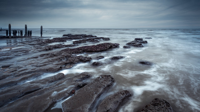 Night beach water rocks pier free wallpaper for desktop - medium preview image