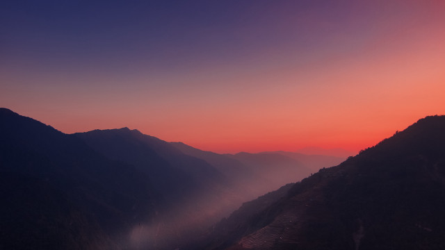 Mountain range sunset foggy valley free wallpaper for desktop - medium preview image