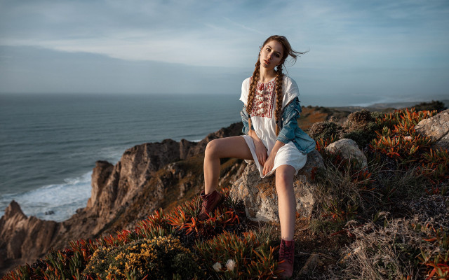 Woman ocean rock beach portrait free wallpaper for desktop - medium preview image