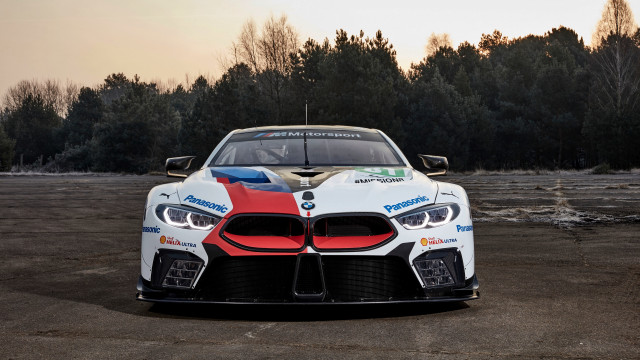 Bmw racecar parkinglot trees sky free wallpaper for desktop - medium preview image