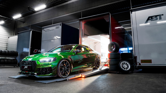 Green car loading trailer truck free wallpaper for desktop - medium preview image