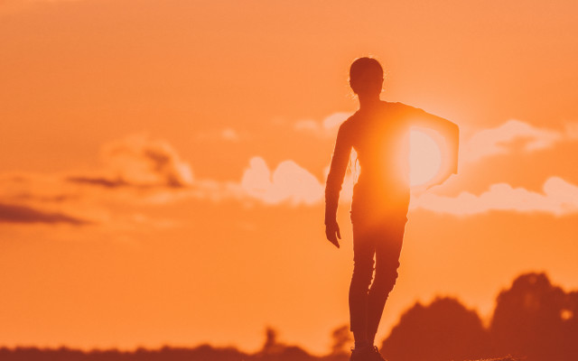 Man surfboard rock sunset silhouette free wallpaper for desktop - medium preview image