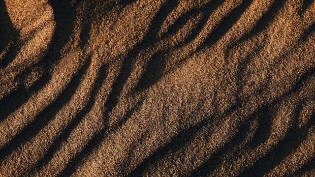 Sand dune closeup brown background free wallpaper for desktop - medium preview image