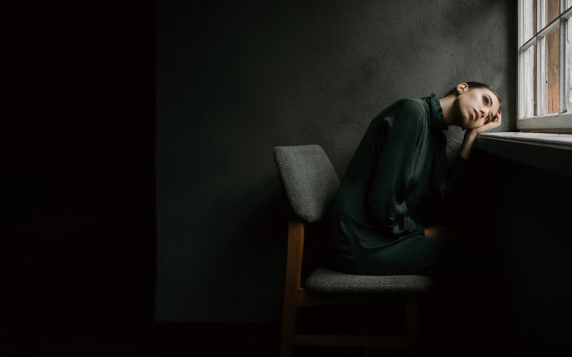 Woman sitting chair window cinematic free wallpaper for desktop - medium preview image