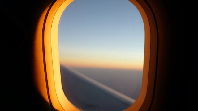 Airplane wing window sunset liminal free wallpaper for desktop - medium preview image