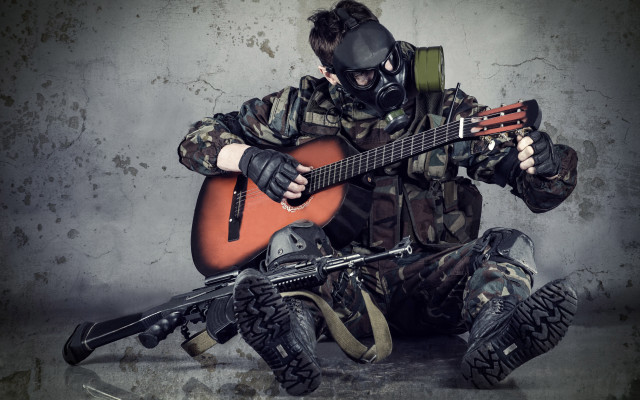 Man gasmask playing guitar sitting free wallpaper for desktop - medium preview image