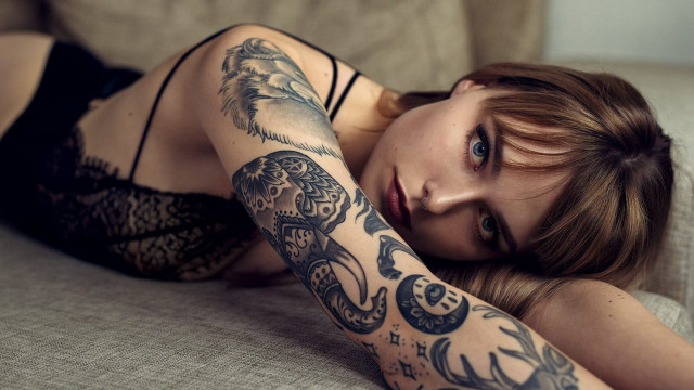 Woman tattoo couch arabesque laying free wallpaper for desktop - medium preview image