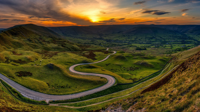 Winding road lush green valley free wallpaper for desktop - medium preview image