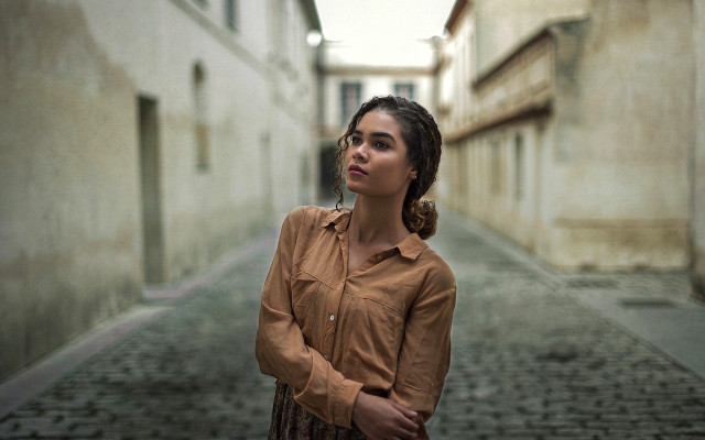 Woman alleyway brown shirt serious free wallpaper for desktop - medium preview image