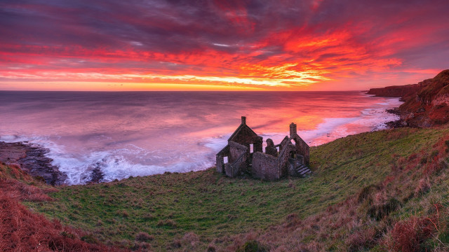 Sunset cliff grassy field water free wallpaper for desktop - medium preview image