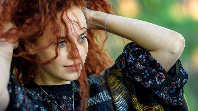 Red haired woman posing blowing free wallpaper for desktop - medium preview image