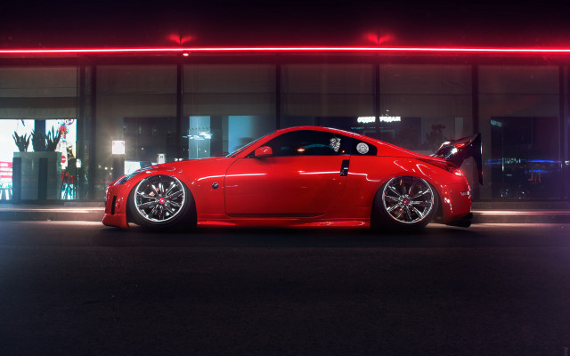 Red sports car night building free wallpaper for desktop - medium preview image