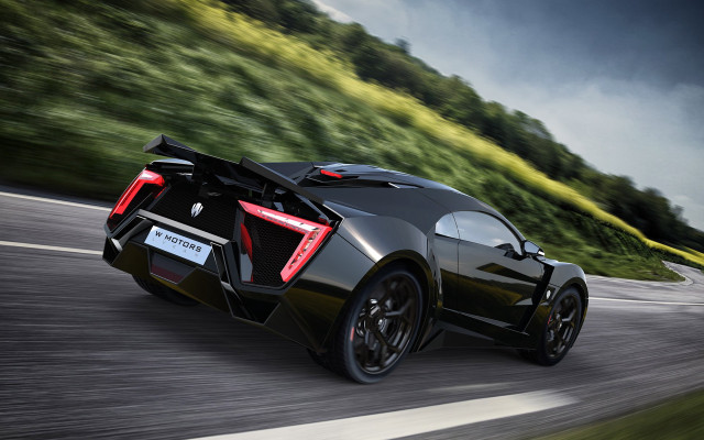 Black sports car green hillside #2 free wallpaper for desktop - medium preview image