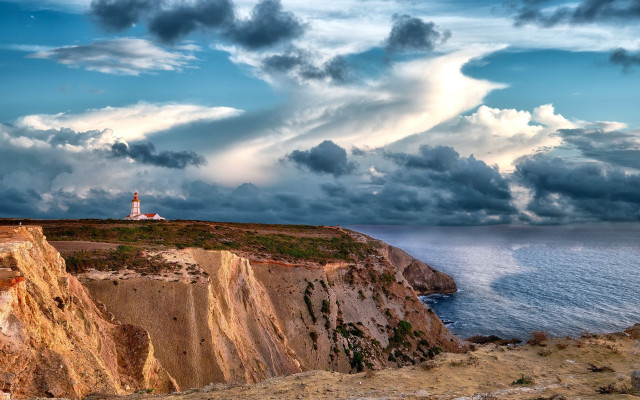 Lighthouse cliff ocean cloudy sky #2 free wallpaper for desktop - medium preview image