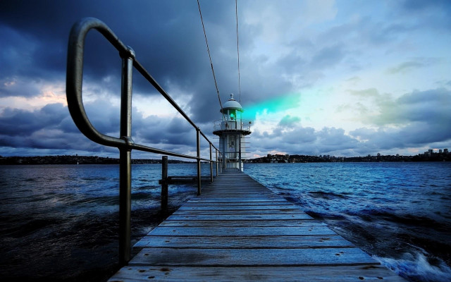 Lighthouse pier night clouds water free wallpaper for desktop - medium preview image