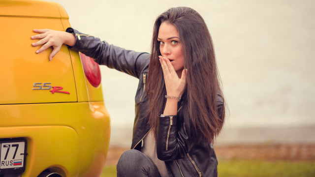 Woman yellowcar serious fashion journalism free wallpaper for desktop - medium preview image