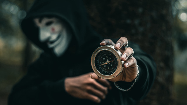 Creepy hooded person clock mask free wallpaper for desktop - medium preview image