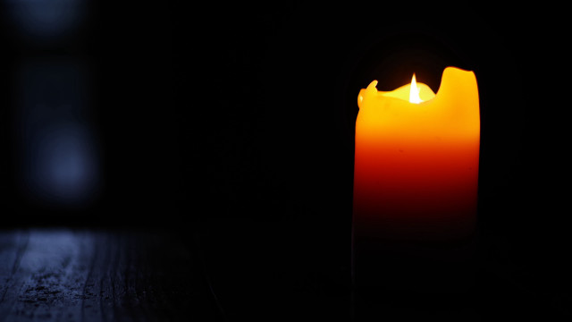 Lit candle dark background gothic free wallpaper for desktop - medium preview image