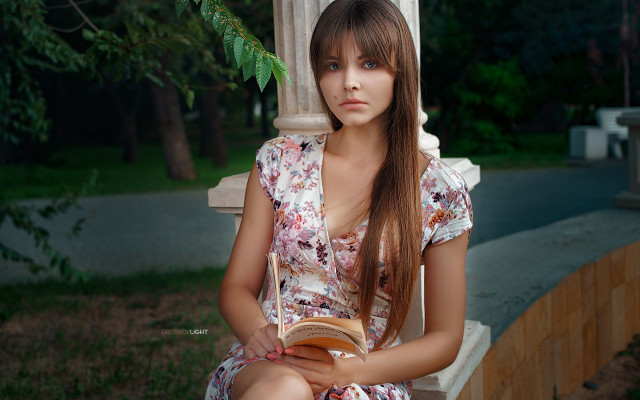 Woman bench book serious portrait free wallpaper for desktop - medium preview image