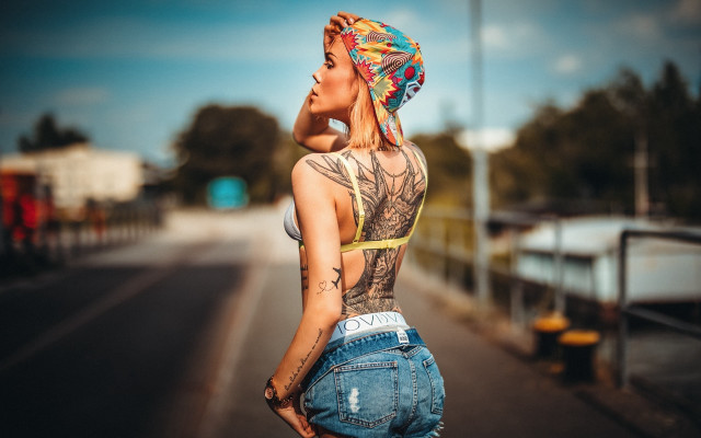 Woman tattoos yellow top street free wallpaper for desktop - medium preview image