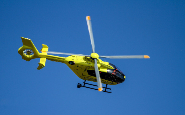 Yellow helicopter blue sky propellers free wallpaper for desktop - medium preview image