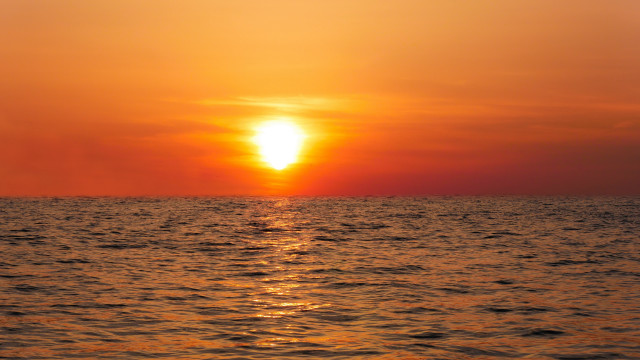 Sunset ocean boat distant cloud free wallpaper for desktop - medium preview image