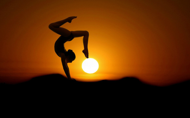 Handstand sunset silhouette moon orange free wallpaper for desktop - medium preview image