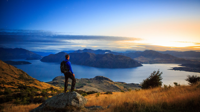 Mountain lake sunset man backpack free wallpaper for desktop - medium preview image