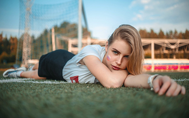 Girl laying on ground soccer free wallpaper for desktop - medium preview image