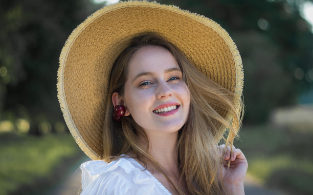 Woman yellow hat smiling tree free wallpaper for desktop - medium preview image