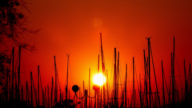 Sunset tall poles orange sky free wallpaper for desktop - medium preview image