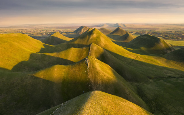 Grassy mountains cloudy sky tiltshift free wallpaper for desktop - medium preview image