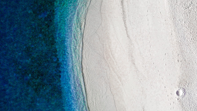 Beach ocean sand land art free wallpaper for desktop - medium preview image