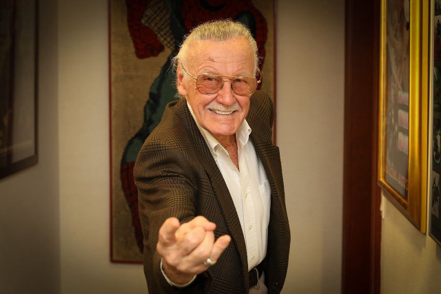 Man suit glasses pointing smiling free wallpaper for desktop - medium preview image