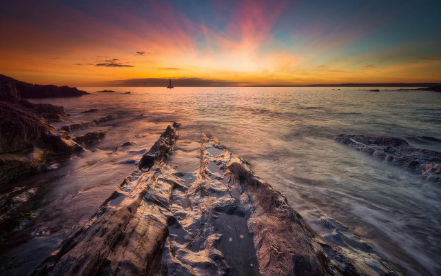 Sunset ocean boat rocky shore #2 free wallpaper for desktop - medium preview image