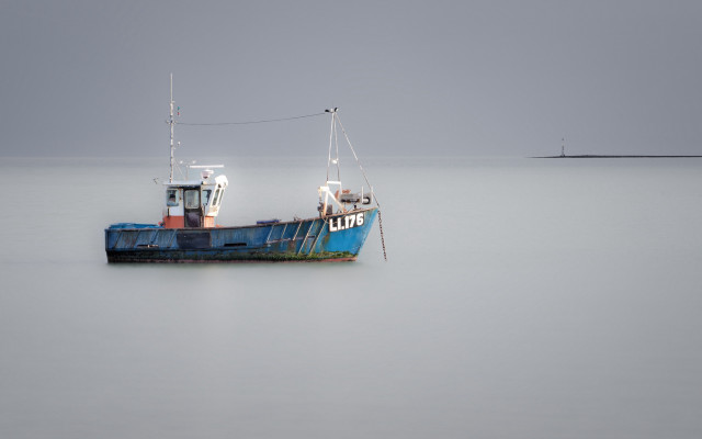 Boat foggy lighthouse longexposure tiltshift free wallpaper for desktop - medium preview image