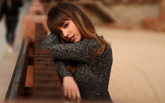 Woman leaning bench serious brown free wallpaper for desktop - medium preview image