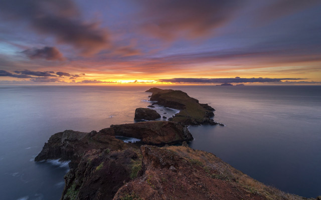 Sunset coastline rocks water reflection free wallpaper for desktop - medium preview image