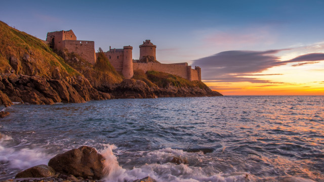 Castle cliff ocean sunset waves free wallpaper for desktop - medium preview image