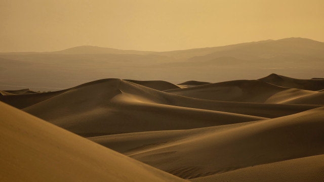 Desert sand dunes mountains hazy free wallpaper for desktop - medium preview image